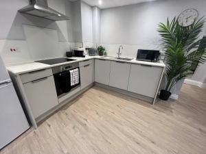 Η κουζίνα ή μικρή κουζίνα στο Westhill Road Apartment