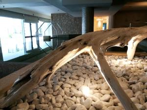 a bed made out of logs and rocks at Hotel Terme Marine Leopoldo II TERME & SPA in Marina di Grosseto