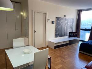 a living room with a white table and a couch at Tyche Suite Luxury in Lecce