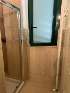 a shower with a glass door in a bathroom at Tyche Suite Luxury in Lecce +21 photos
