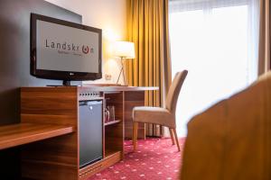 TV a/nebo společenská místnost v ubytování Hotel Landskron