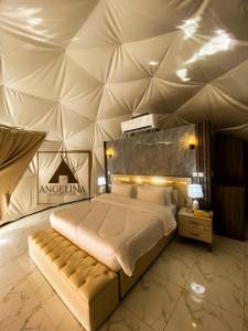 a bedroom with a large bed in a tent at Angelina Luxury Camp in Aqaba