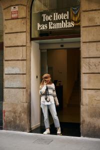 a woman standing outside of a hotel las las emulsinas at TOC Hotel Las Ramblas in Barcelona