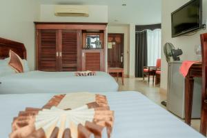Tempat tidur dalam kamar di Hung Long Harbour Hotel