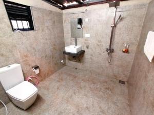 a bathroom with a toilet and a sink at Bambara Ella Agro Resort & Camping in Haputale