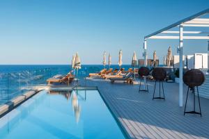a swimming pool on the deck of a cruise ship at Melia Ibiza - Adults Only in Santa Eularia des Riu