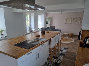 a kitchen with a island with a counter top at Le clos Champlieu in Orrouy