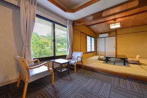 Letto o letti in una camera di Ooedo Onsen Monogatari Hotel Suiyotei