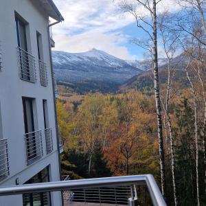 a view of a mountain from the balcony of a building at Apartamenty KADO (MATEJKI) in Karpacz
