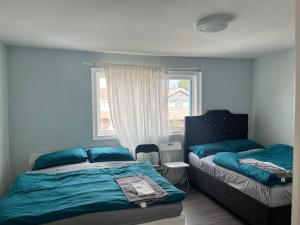 Een bed of bedden in een kamer bij Flowealth Property