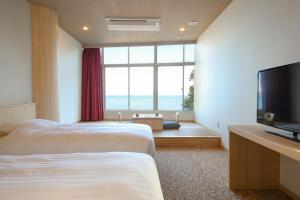 Letto o letti in una camera di Ooedo Onsen Monogatari Hotel Suiyotei