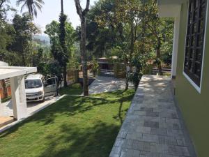 a view of a yard from a house at B'camp Resorts & Homestays in Wayanad