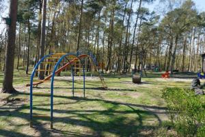 a playground with a slide in a park at Camping Aller Leine Tal in Engehausen