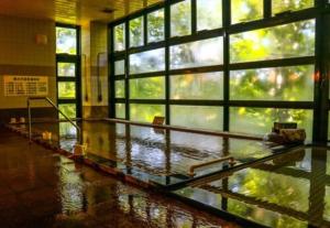 a large room with a large window with water on the floor at Berjaya Hakkoda Ski Resort in Aomori