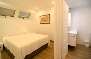 Posteľ alebo postele v izbe v ubytovaní Passeig Del Mar - apartamentos primera linea + 37 fotografií