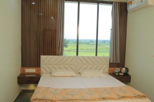 Postelja oz. postelje v sobi nastanitve Bishnupur River Side Resort