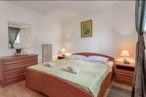 Postel nebo postele na pokoji v ubytování Apartmani Mara