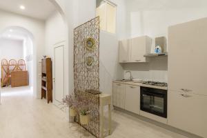 a kitchen with a stove and a window in it at Il Salotto in Foligno