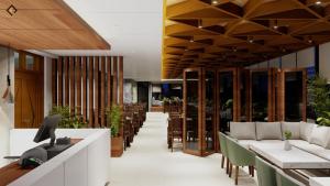 a restaurant with wooden ceilings and tables and chairs at Hotel Grand Akther Sylhet in Sylhet