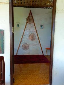 a room with a pyramid shaped doorway with a room with a room at FrancoEly's A Family Camp in Daliao