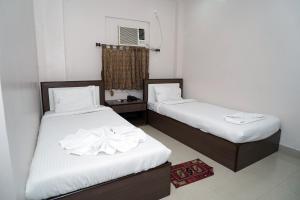 Postel nebo postele na pokoji v ubytování Sonar Bangla Guest House