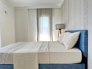 Posteľ alebo postele v izbe v ubytovaní Harika konumlu popüler ev 2+1