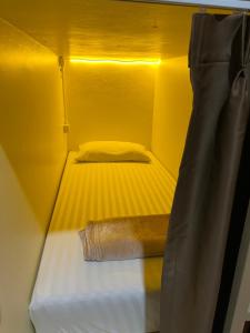 Łóżko lub łóżka w pokoju w obiekcie LONGDOO Hostel