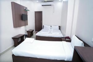 Postel nebo postele na pokoji v ubytování Sonar Bangla Guest House