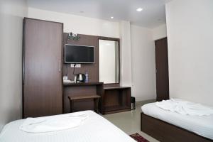 Postel nebo postele na pokoji v ubytování Sonar Bangla Guest House