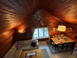 an overhead view of a living room in a log cabin at Beautiful Cabin by Mjøsa. in Stange