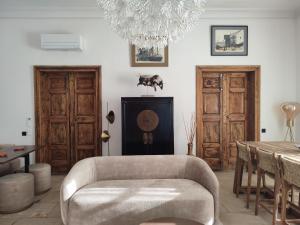 a living room with a couch and a table at Bastide Castella in Montpellier