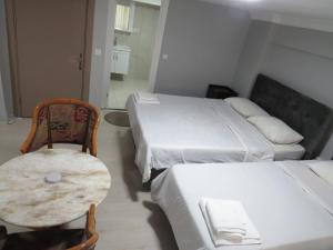 Ένα ή περισσότερα κρεβάτια σε δωμάτιο στο kaya hotel