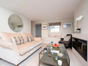 a living room with a couch and a table at 2 Bed in Cartmel 73154 in Cartmel