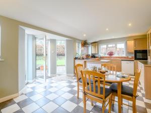 a kitchen and dining room with a table and chairs at 2 Bed in Tiverton 77884 in Bolham