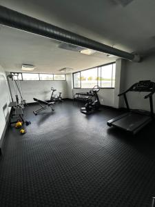 a gym with several exercise bikes in a room at Cozy Retreat in Windhoek in Windhoek