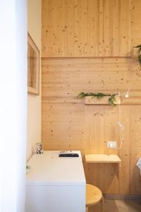 a kitchen with wooden walls and a white counter at B&B In Natura in Salerno