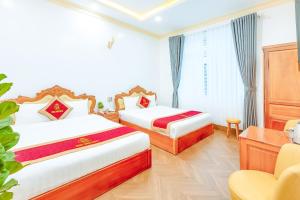 Ένα ή περισσότερα κρεβάτια σε δωμάτιο στο Ngọc Sang 2 Hotel