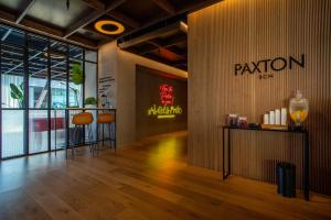 a lobby of a restaurant with a sign on the wall at Hotel Paxton Barcelona in Barcelona