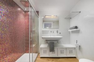 a white bathroom with a sink and a shower at Londres Derecha in Port de Pollensa +5 photos