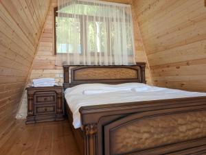 Tempat tidur dalam kamar di Prime House Cottages