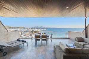 a living room with a view of the ocean at Apartment Vistamar IV in Port de Pollensa