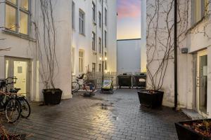 a courtyard with bikes parked next to some buildings at Central and modern in Oslo