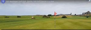 a golf course with a red flag on the green at Church Point holiday park, Newbiggin by the sea Northumberland in Newbiggin-by-the-Sea