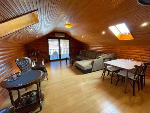 a living room with a couch and a table at SOFIA APARTMENTS in Thessaloniki