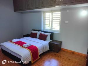 Voodi või voodid majutusasutuse JK - 4 BHK Villa toas