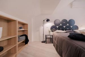 Tempat tidur dalam kamar di Loft Fred - by Casêta