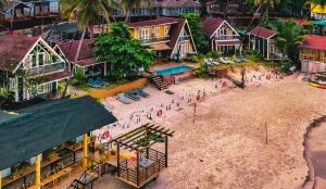 an aerial view of a beach with a group of people at The Ark Comforts in Palolem