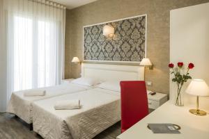 Krevet ili kreveti u jedinici u okviru objekta Nuovo Hotel Del Porto