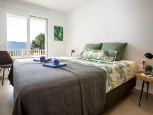 Łóżko lub łóżka w pokoju w obiekcie Villa Villa Cara Mull Alcalalí by Interhome