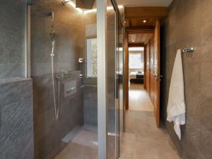 een badkamer met een douche en een inloopdouche bij Apartment Dianthus-2 by Interhome in Zermatt